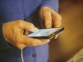 person holding silver iphone 6