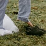 A person steps into slippers outdoors, embracing a cozy morning vibe.